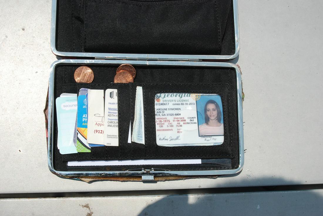 The contents of Caroline Small's wallet at the time of the shooting. (Crime scene photo)